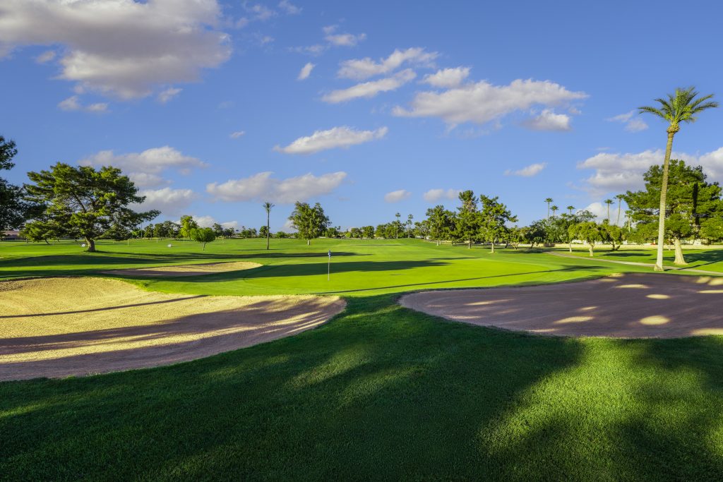 Fairway bunkers and palm trees at Union Hills Golf Club in Sun City, AZ