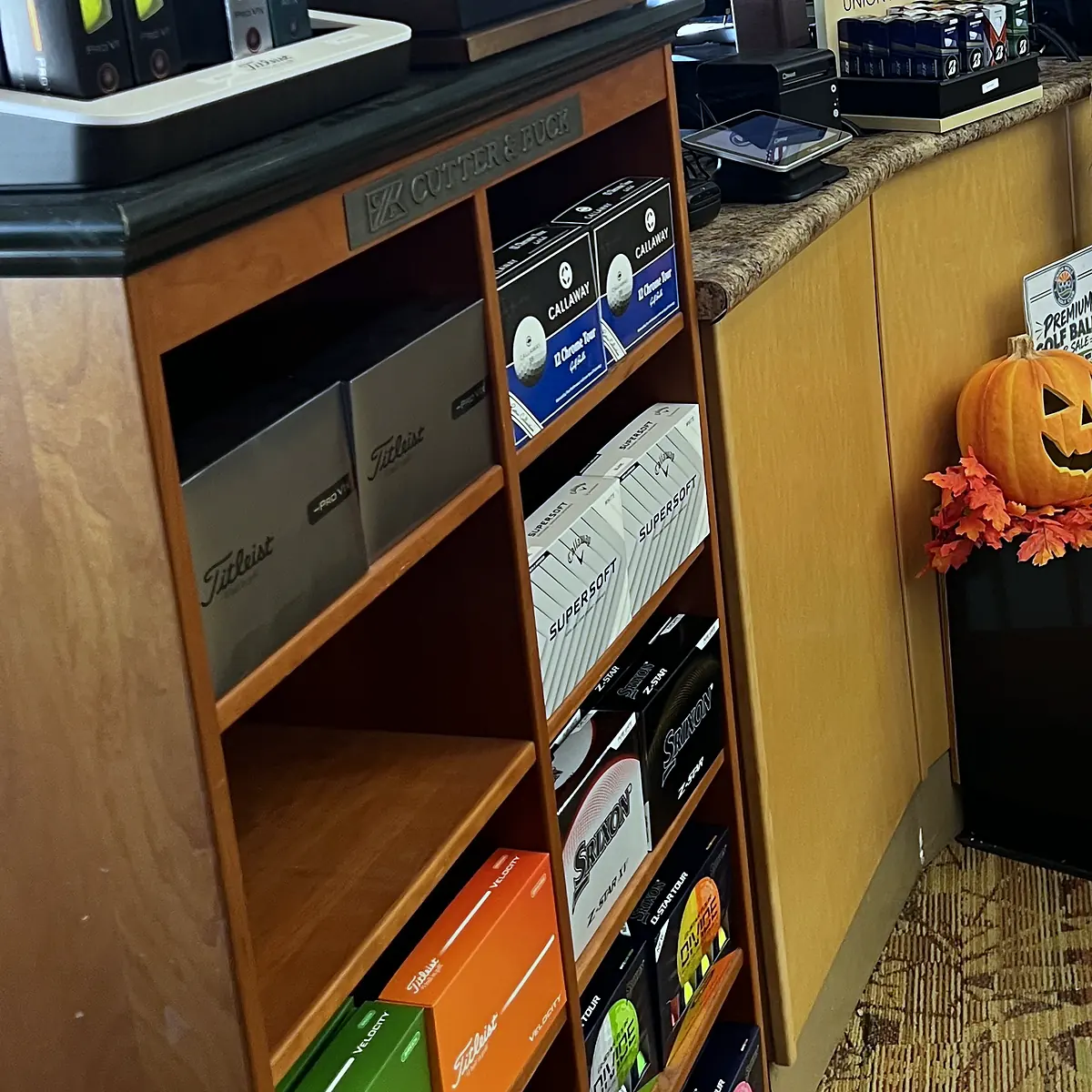 Titleist and Srixon golf balls at the Union Hills golf shop counter